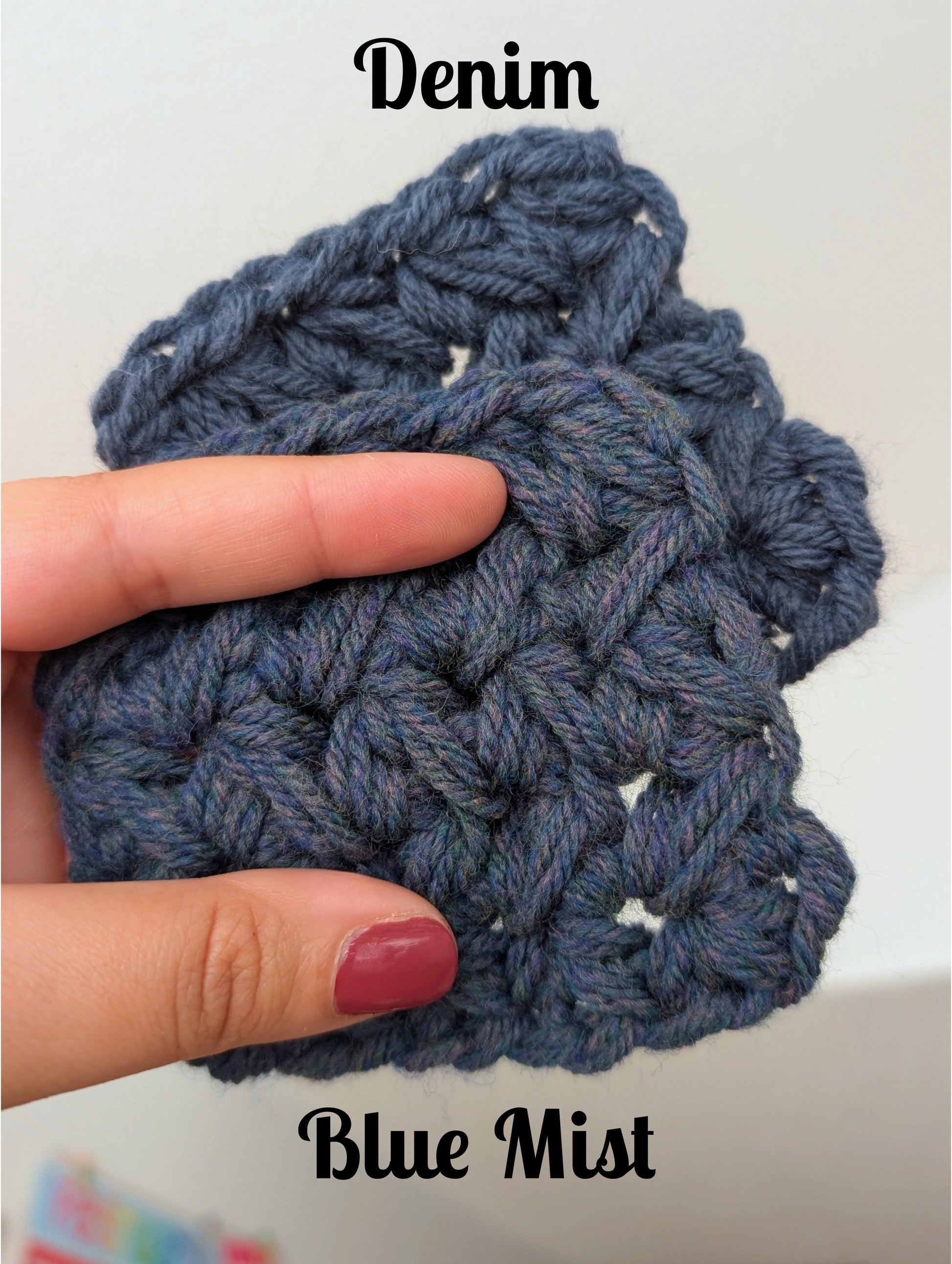 Blue mist denim crochet swatch held by a hand on a white background