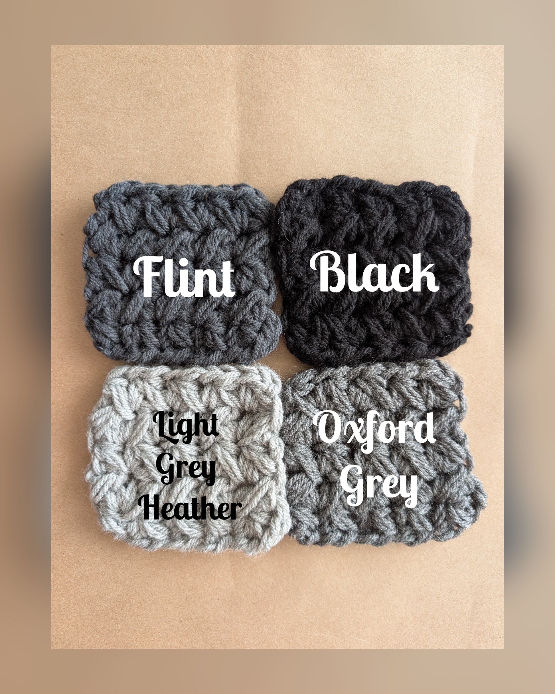 Four textured fabric samples labeled 'Flint', 'Black', 'Light Grey Heather', and 'Oxford Grey' on a brown background.