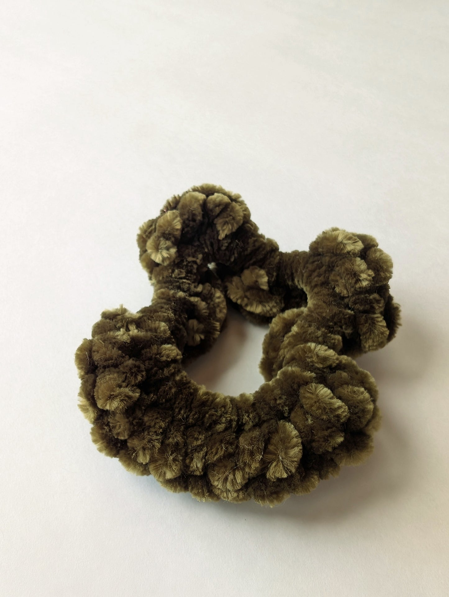Green-Brown scrunchie on a white background