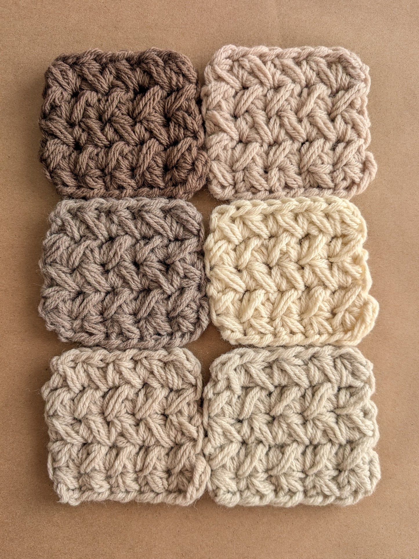 Six crocheted squares in brown and beige tones on a brown background